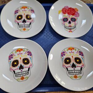 set of four fun sugar skulls plates day of the dead